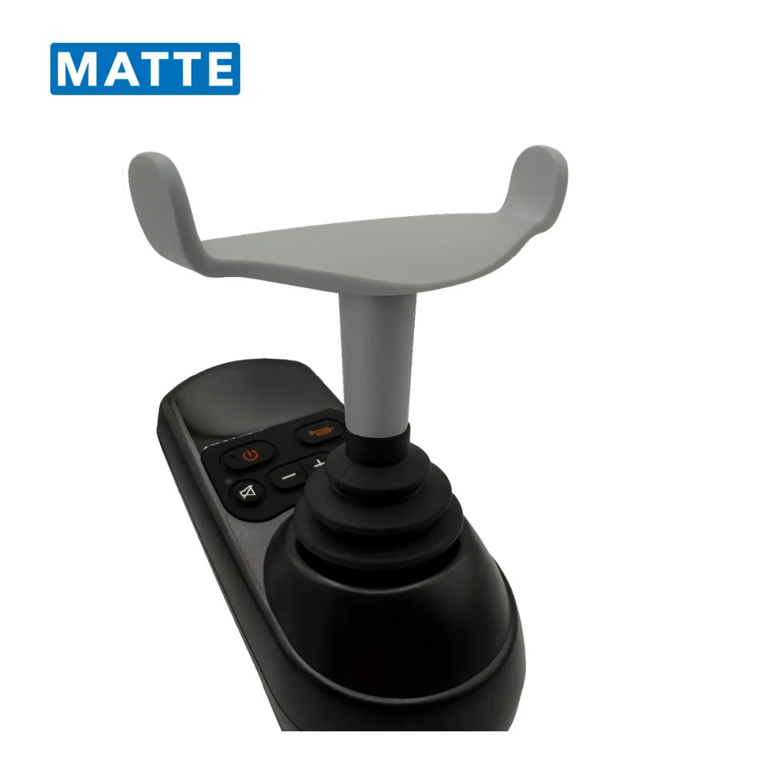 A close-up of the ComfyGo Ergonomic U-Shaped Joystick Handle with Flex Shaft for Powerchairs, featuring a wide gray grip and control buttons on its matte black base, set against a white background.